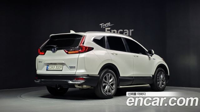 Honda CR-V 5-го поколения 2.0 Hybrid Touring 4WD - фото 1