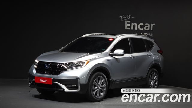 Honda CR-V 5-го поколения 2.0 Hybrid Touring 4WD - фото 0