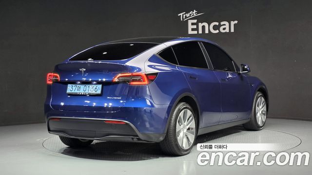Tesla Model Y Long Range AWD - фото 1