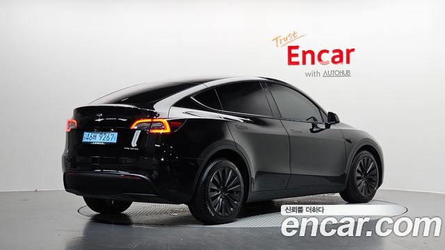 Tesla Model Y Long Range AWD - фото 1