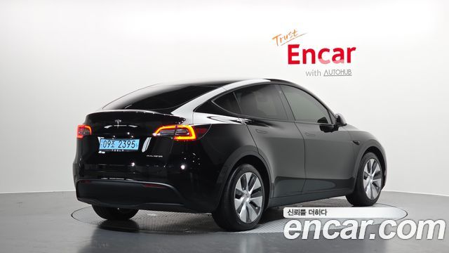 Tesla Model Y Long Range AWD - фото 1
