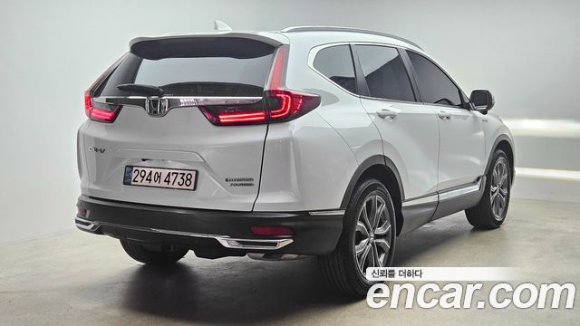 Honda CR-V 5-го поколения 2.0 Hybrid Touring 4WD - фото 1