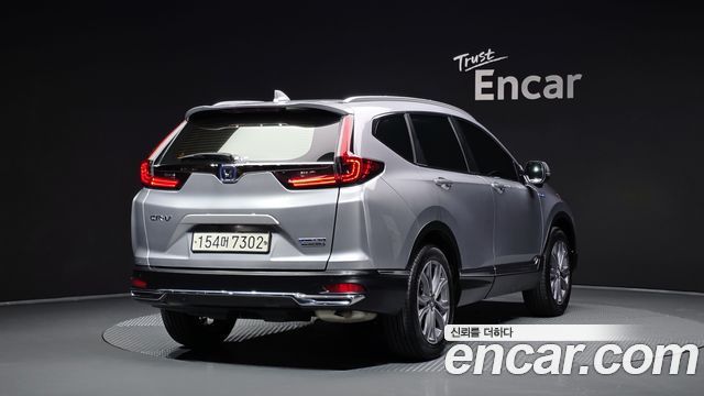Honda CR-V 5-го поколения 2.0 Hybrid Touring 4WD - фото 1