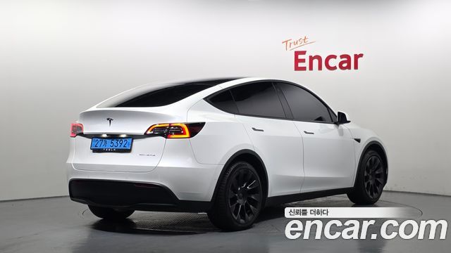 Tesla Model Y Long Range AWD - фото 1
